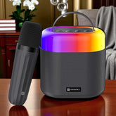 Portable speaker with colorful lighting and microphone on a wooden surface